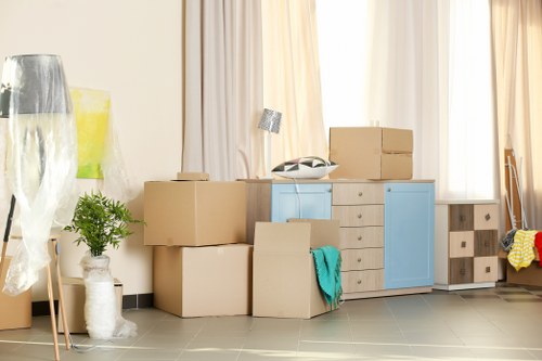 Mover using PPE while handling furniture carefully