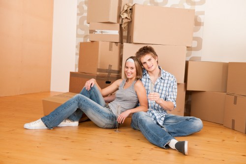 Removal team planning a move in Colliers Wood with boxes and furniture