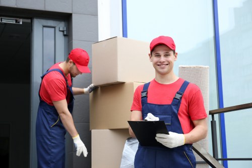 Removal company moving boxes in Collierswood home