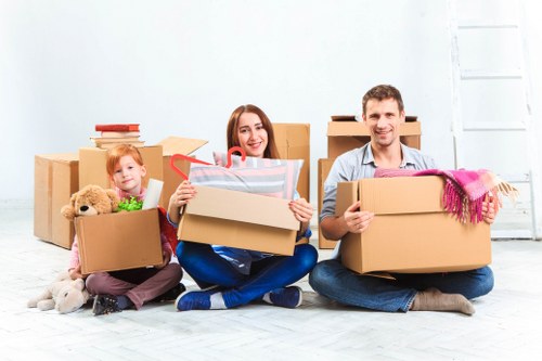 Man with van removal service helping a Colliers Wood customer move household items