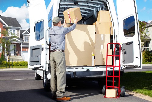 Professional movers loading furniture into a van