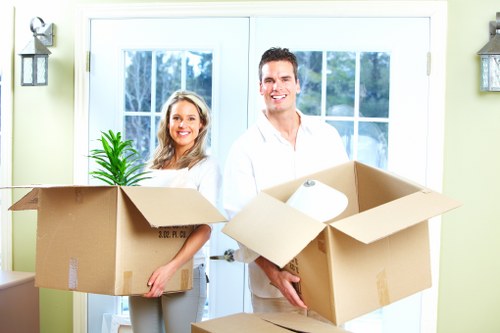 Packed boxes and furniture prepared for urgent moving service