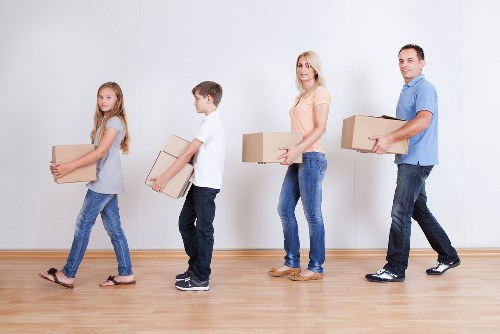Professional movers loading belongings for a same day relocation